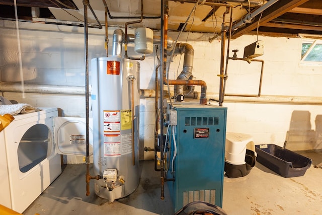 utility room with water heater, washing machine and dryer, and a heating unit