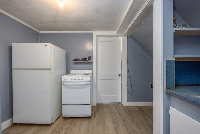kitchen with light wood-style floors, baseboards, vaulted ceiling, and white appliances