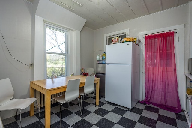 dining space with dark floors