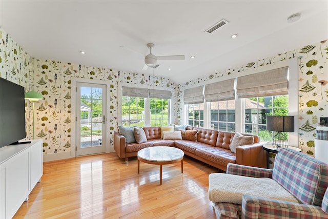 living room featuring wallpapered walls, light wood-style floors, plenty of natural light, ceiling fan, and recessed lighting