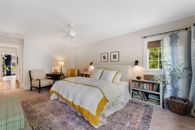 carpeted bedroom with a ceiling fan