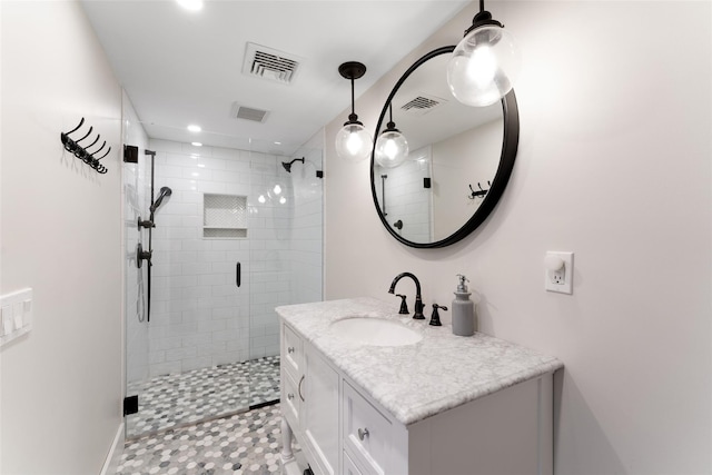 full bath featuring a stall shower, vanity, recessed lighting, and baseboards