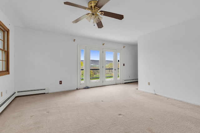empty room featuring baseboards, a ceiling fan, carpet, and baseboard heating