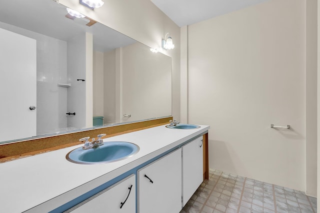 bathroom featuring double vanity and a sink