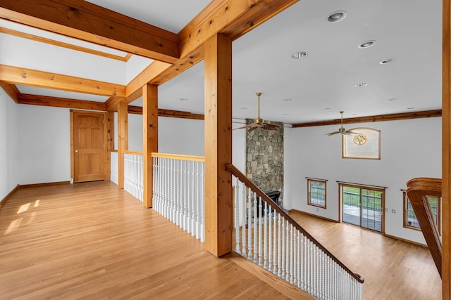 corridor with recessed lighting, baseboards, and light wood-type flooring