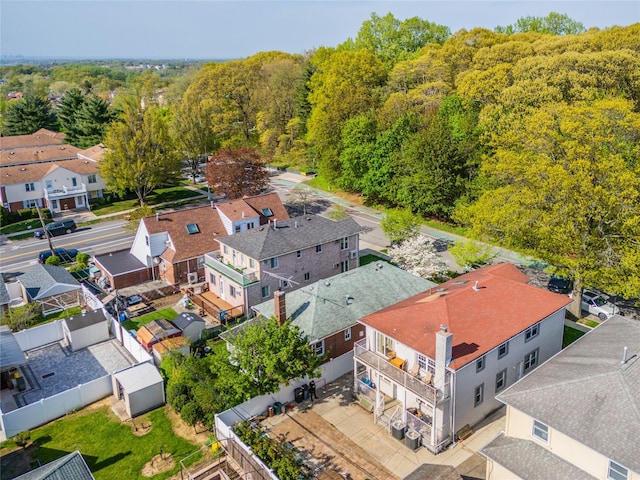 aerial view with a residential view and a view of trees