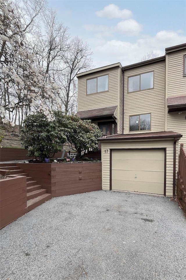 17 Cherry Ct, Highland Mills, NY 10930 - view of front of house with an attached garage, fence, and driveway