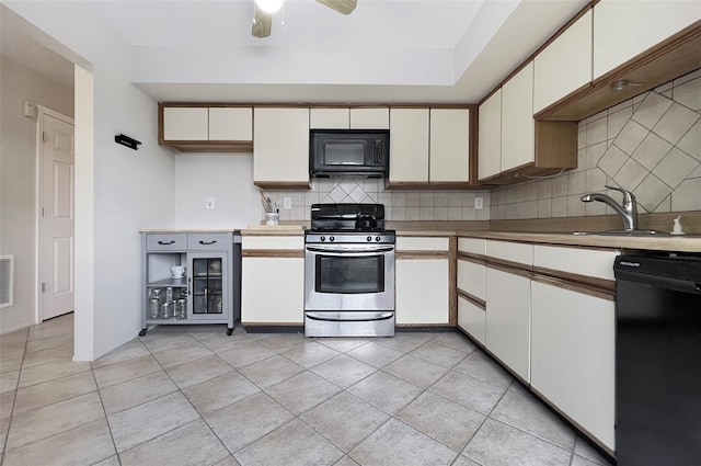 17 Cherry Ct, Highland Mills, NY 10930 - kitchen with backsplash, light tile patterned flooring, ceiling fan, and black appliances