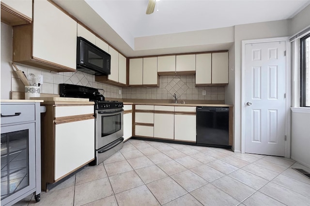 17 Cherry Ct, Highland Mills, NY 10930 - kitchen featuring backsplash, a sink, light tile patterned floors, and black appliances