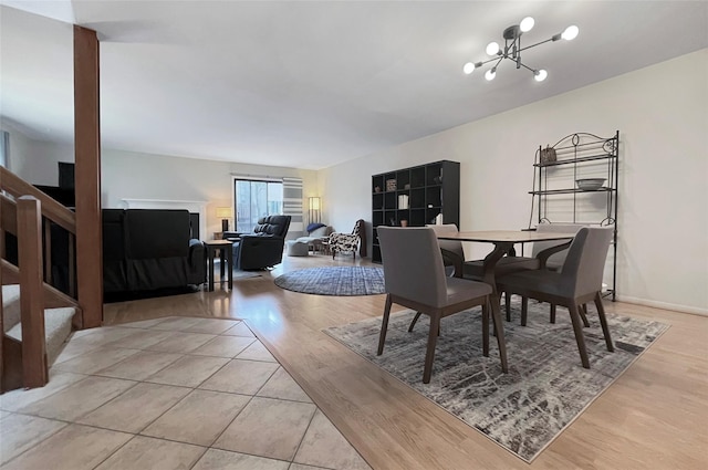 17 Cherry Ct, Highland Mills, NY 10930 - dining area with an inviting chandelier, stairway, and light wood-style flooring
