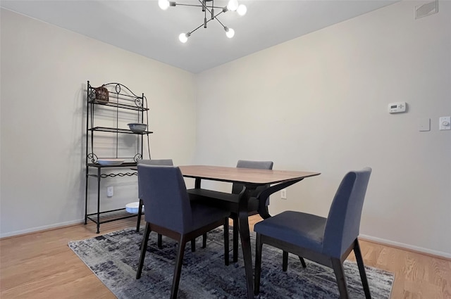 17 Cherry Ct, Highland Mills, NY 10930 - dining area featuring light wood-style floors, baseboards, and a notable chandelier