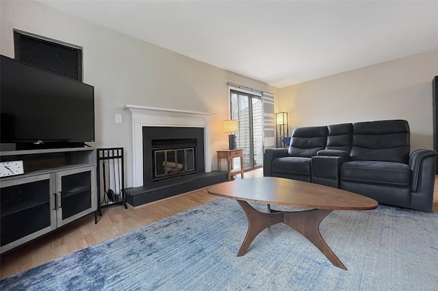 17 Cherry Ct, Highland Mills, NY 10930 - living room featuring a glass covered fireplace and wood finished floors
