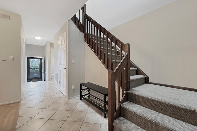 17 Cherry Ct, Highland Mills, NY 10930 - stairway featuring tile patterned floors and baseboards