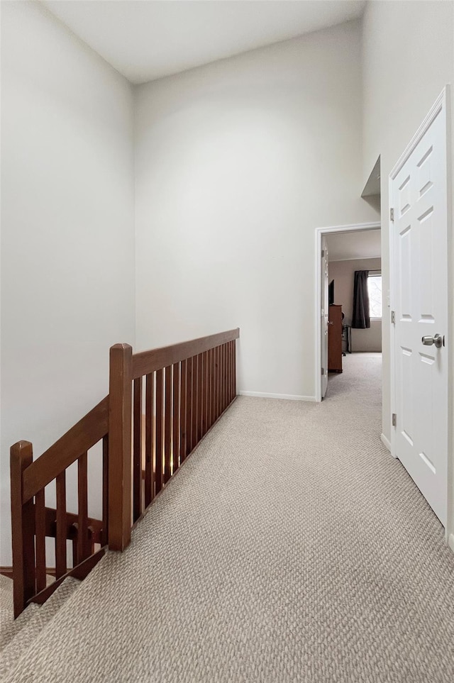 17 Cherry Ct, Highland Mills, NY 10930 - corridor featuring carpet floors, baseboards, a high ceiling, and an upstairs landing