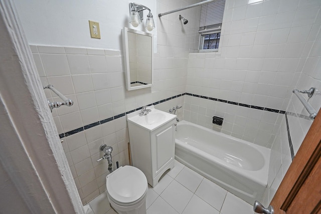 1754 Seward Ave, Bronx, NY 10473 - full bathroom featuring tile walls, vanity, tile patterned floors, toilet, and tub / shower combination