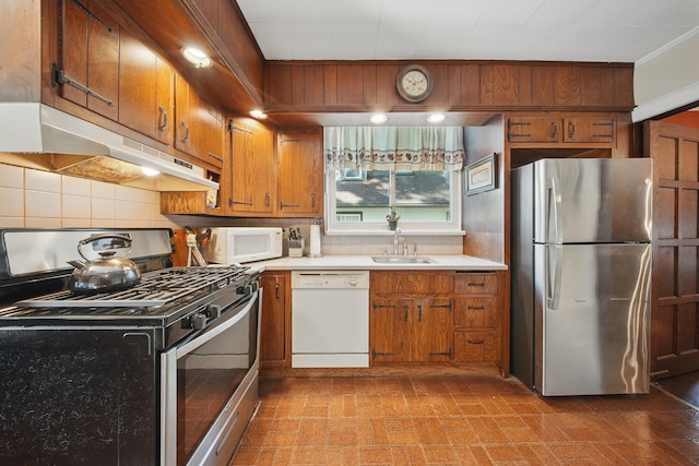 kitchen with decorative backsplash, stainless steel appliances, brown cabinets, and under cabinet range hood