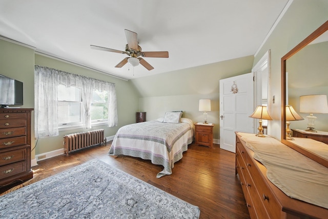 bedroom featuring baseboards, ceiling fan, dark wood-style floors, and radiator heating unit