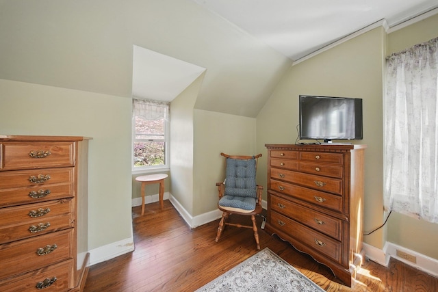 living area featuring baseboards, vaulted ceiling, and dark wood-style floors