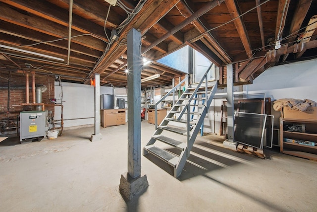 unfinished basement featuring stairway