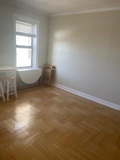 83-44 Lefferts Blvd Unit 6M, Kew Gardens, NY 11415 - unfurnished room featuring baseboards and ornamental molding