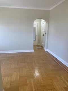 83-44 Lefferts Blvd Unit 6M, Kew Gardens, NY 11415 - unfurnished room featuring baseboards, arched walkways, and ornamental molding