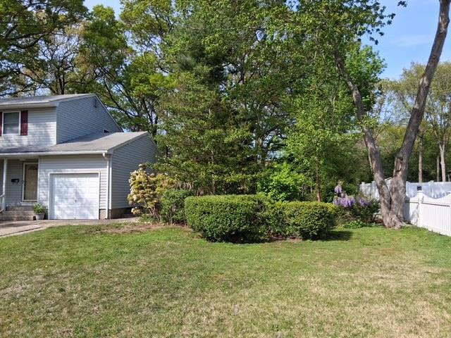 view of yard featuring an attached garage