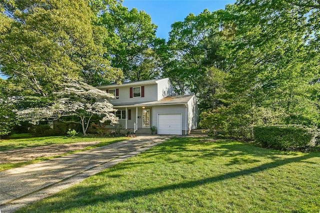 54 Schuyler Dr, Commack, NY 11725 - traditional-style house featuring a front yard, driveway, and a garage