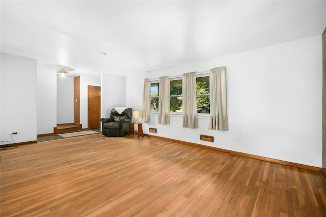 54 Schuyler Dr, Commack, NY 11725 - living room featuring light wood finished floors and baseboards