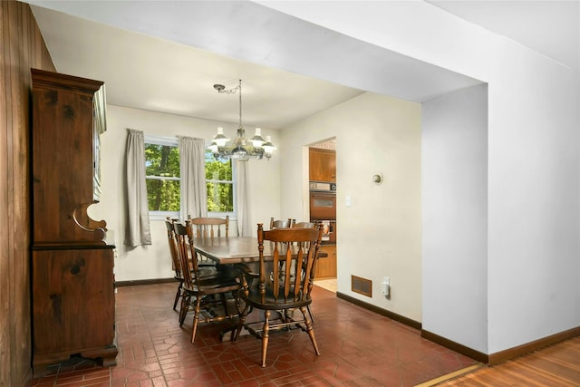 54 Schuyler Dr, Commack, NY 11725 - dining area with baseboards and a chandelier