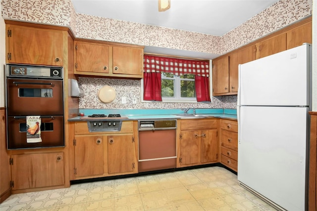 54 Schuyler Dr, Commack, NY 11725 - kitchen featuring freestanding refrigerator, dishwashing machine, multiple ovens, light flooring, and stainless steel gas stovetop