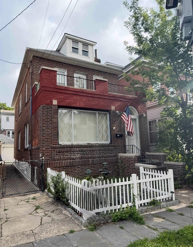 133 E 238th St, Bronx, NY 10470 - view of front of home with brick siding and a fenced front yard