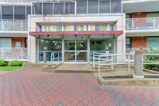 61-55 98th St Unit 8D, Rego Park, NY 11374 - doorway to property featuring brick siding