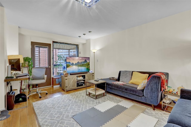 61-55 98th St Unit 8D, Rego Park, NY 11374 - living room with wood finished floors, an office area, and baseboards