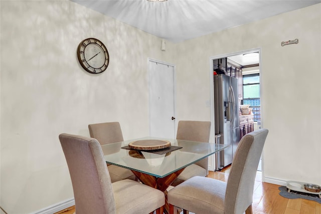 61-55 98th St Unit 8D, Rego Park, NY 11374 - dining area featuring wood finished floors and baseboards