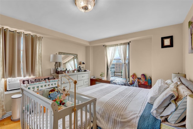61-55 98th St Unit 8D, Rego Park, NY 11374 - bedroom with light wood-type flooring