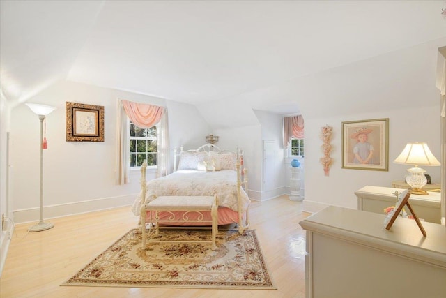 82 E Cedar St, Poughkeepsie, NY 12601 - bedroom with lofted ceiling, light wood-style flooring, and baseboards