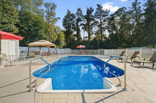 82 E Cedar St, Poughkeepsie, NY 12601 - view of pool with a patio area, a gazebo, a fenced backyard, and view of wooded area
