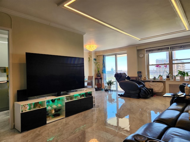 living room featuring crown molding, a tray ceiling, and marble finish floor