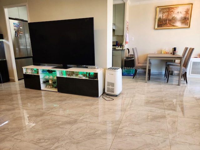 living area featuring ornamental molding and marble finish floor