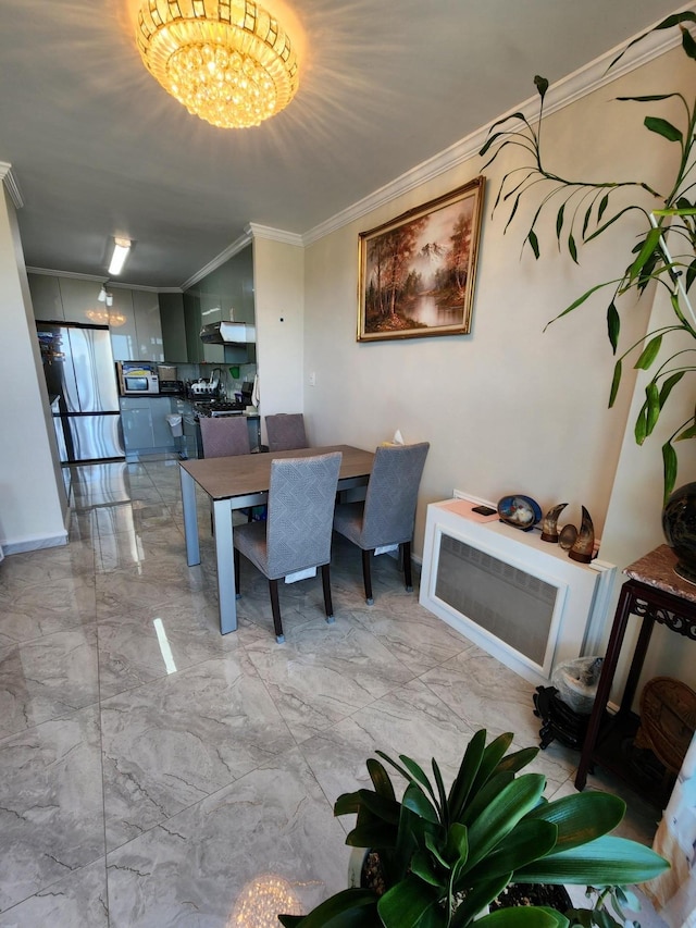 dining space with crown molding, an inviting chandelier, and marble finish floor