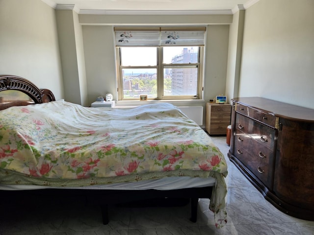 bedroom with crown molding