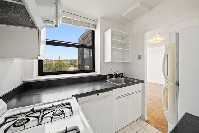 23 Water Grant St Unit 11C, Yonkers, NY 10701 - kitchen featuring white dishwasher, dark countertops, open shelves, a sink, and white cabinetry