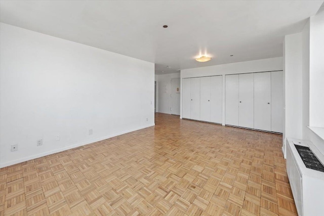 23 Water Grant St Unit 11C, Yonkers, NY 10701 - unfurnished bedroom with two closets and baseboards