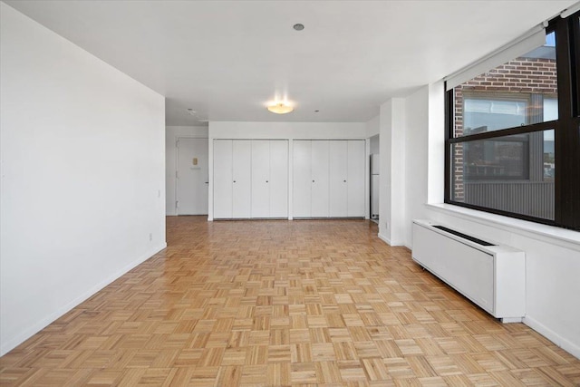 23 Water Grant St Unit 11C, Yonkers, NY 10701 - unfurnished bedroom featuring radiator and baseboards