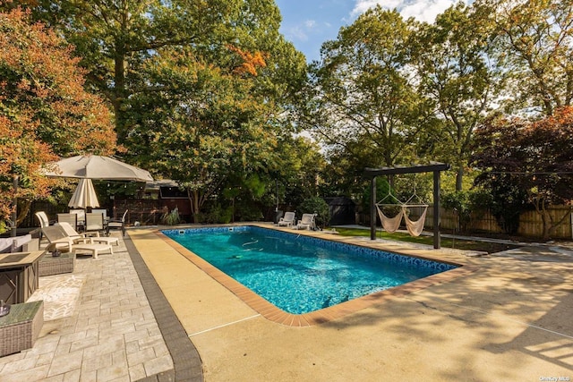 view of pool with a patio, a fenced backyard, and a fenced in pool