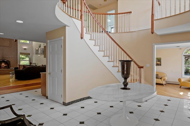 4 Pine Glen Dr, Blauvelt, NY 10913 - stairs with baseboards, a high ceiling, tile patterned floors, and baseboard heating
