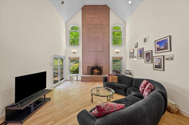 4 Pine Glen Dr, Blauvelt, NY 10913 - living room with baseboards, high vaulted ceiling, wood finished floors, and a fireplace