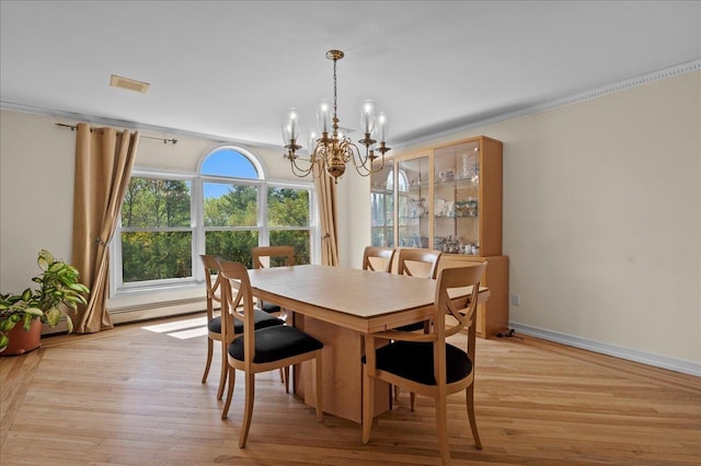 4 Pine Glen Dr, Blauvelt, NY 10913 - dining area with an inviting chandelier, baseboards, crown molding, and light wood-type flooring