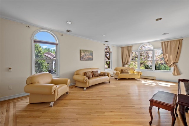 4 Pine Glen Dr, Blauvelt, NY 10913 - living area featuring visible vents, crown molding, baseboards, a baseboard heating unit, and light wood finished floors