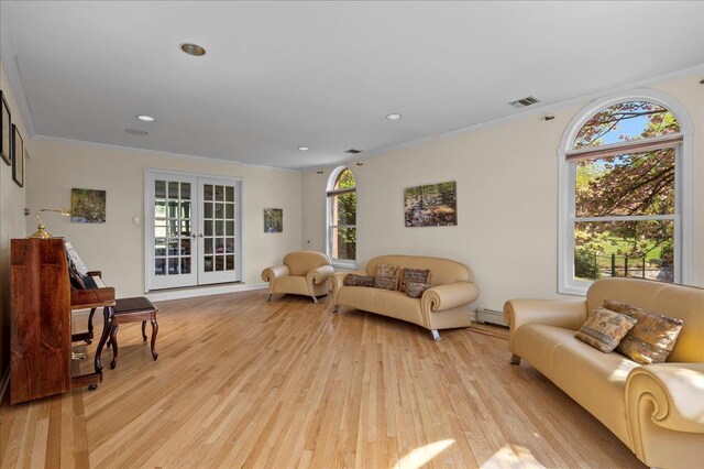 4 Pine Glen Dr, Blauvelt, NY 10913 - living room featuring crown molding, a baseboard heating unit, visible vents, and light wood-style floors
